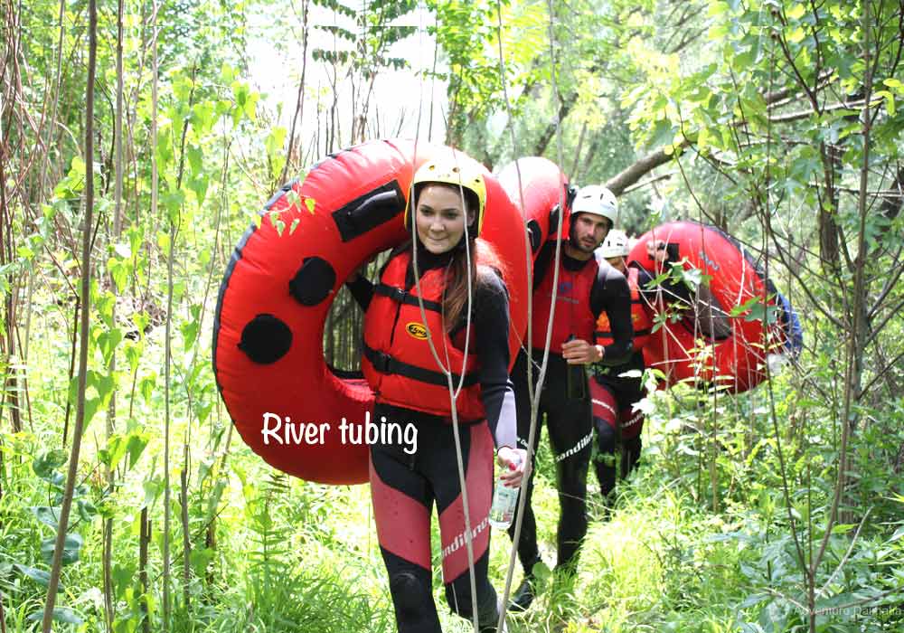 Riding the river rapids on rubber rings. 